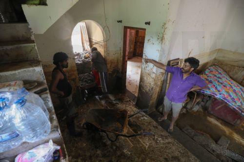 epa12587677 Landslide victims remove mud and debris from their damaged house after landslides in Badulla, Sri Lanka, 12 December 2025. Many parts of the island had been inundated, and there had been many landslides due to Cyclone Ditwah. According to the Sri Lanka Disaster Management Center, More than 630 people have been killed, and 193 are missing around...