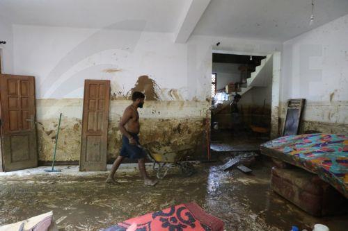 epa12587681 Landslide victims remove mud and debris from their damaged house after landslides in Badulla, Sri Lanka, 12 December 2025. Many parts of the island had been inundated, and there had been many landslides due to Cyclone Ditwah. According to the Sri Lanka Disaster Management Center, More than 630 people have been killed, and 193 are missing around...