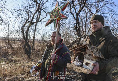 epa12612275 A handout photo made available by the press service of the 33rd Separate Mechanized Brigade of Ukrainian Armed Forces shows servicemen of the 33rd Separate Mechanized Brigade celebrating Christmas at their position on a frontline in Donetsk region, Ukraine, 25 December 2025, amid the ongoing Russian invasion. Ukraine celebrates Christmas on 25...