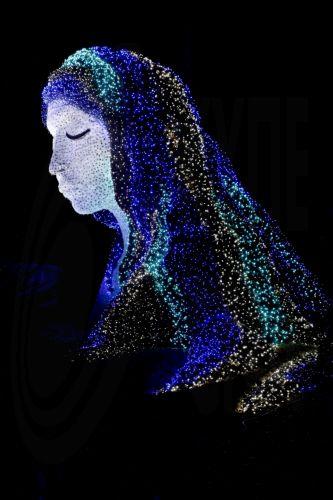 epa12612689 The 'Ice Goddess' light installation is displayed at the Atlanta Botanical Garden's 'Garden Lights, Holiday Nights' display in Atlanta, Georgia, USA, 25 December 2025 (Issued 26 December 2025). The popular holiday light display, in its 15th year, runs through 11 January 2026.  EPA/ERIK S. LESSER