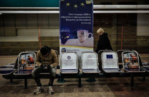 epa12616786 People are seen waiting for the subway train next to a euro adoption poster in Sofia, Bulgaria, 29 December 2025. Bulgaria is set to become the 21st member of the eurozone on 01 January 2026, transitioning from the national lev to the euro amid public concerns that the move could trigger immediate price hikes and a higher cost of living. ...