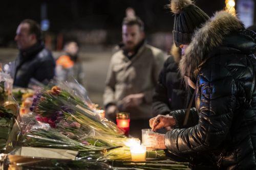 epaselect epa12621016 A woman lights a candle to remember the victims of the fire at the "Le Constellation" bar and lounge leaving people dead and injured, during New Years celebration, in Crans-Montana, Switzerland, 01 January 2026. According to the police, several dozen people lost their lives in the fire that devastated the bar 'Le Constellation' on New...