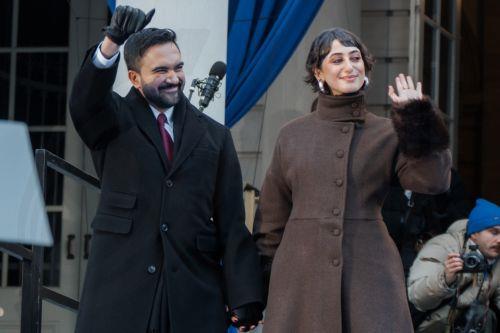 epa12621231 New York City Mayor Zohran Mamdani (L) and his wife Rama Duwaji (R) wave at the crowd during mayoral inauguration in New York, New York, USA, 01 January 2026.  EPA/OLGA FEDOROVA