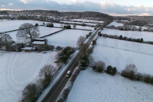 epa12621424 An aerial photograph taken with a drone shows snow on the hills of North Wales in Mold, Britain, 02 January 2026. Areas of Scotland, Wales, and England are under yellow and amber Met Office weather warnings for snow and ice, as cold arctic air from Scandinavia moves across the UK.  EPA/ADAM VAUGHAN