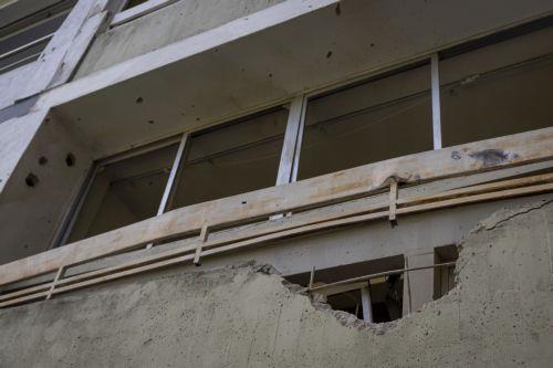 epa12632537 A house damaged after a US attack in Caracas, Venezuela, 06 January 2026. Broken glass, bullet holes, dust, and paint remnants cover furniture and floors in several homes in a Caracas neighborhood affected by the US attack last 03 January, which culminated in the capture of President Nicolas Maduro and his wife, Cilia Flores.  EPA/MIGUEL...