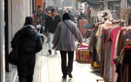 epa12635820 Iranians walk on a street in Tehran, Iran, 08 January 2026. Following a sharp decline in the national currency and soaring prices for basic goods, the country is facing a wave of nationwide anti-government protests which has spread to 37 cities across 24 provinces, according to the Human Rights Activists News Agency (HRANA).  EPA/ABEDIN...