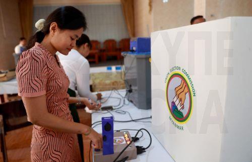 epa12639799 Volunteers of the Union Election Commission (UEC) set up an electronic voting machine at a polling station, one day ahead of the second phase of election in Yangon, Myanmar, 10 January 2026. Myanmar's military government, known as the State Administration Council (SAC), plans to hold its first national vote since the February 2021 coup in a...