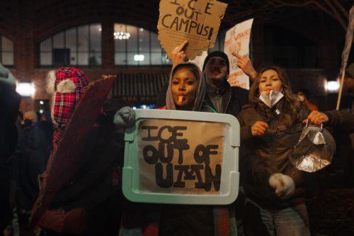 epa12647872 Protesters make noise and hold anti-ICE signs outside a Hilton hotel thought to house federal agents in Minneapolis, Minnesota, USA, 13 January 2026. As part of a federal immigration crackdown involving over 2,000 agents from Border Patrol, Immigration and Customs Enforcement (ICE), and Homeland Security Investigations (HSI), an ICE officer...