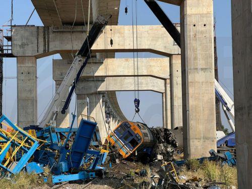 epa12648018 A view of the wreckage of a passenger train after a construction crane collapsed onto it in Sikhio district, Nakhon Ratchasima, Thailand, 14 January 2026. At least 22 people were killed and more than 79 others injured when the crane fell on the Special Express No. 21 train traveling from Bangkok to Ubon Ratchathani, according to local police....