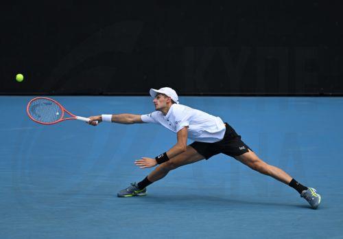 epa12660313 Matteo Arnaldi of Italy in action against Andrey Rublev of Russia durin their men's first round match on day 2 of the 2026 Australian Open tennis tournament at Melbourne Park in Melbourne, Australia, 19 January 2026.  EPA/JAMES ROSS AUSTRALIA AND NEW ZEALAND OUT