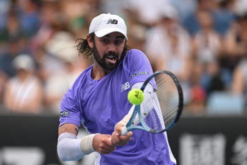 epa12660340 Jordan Thompson of Australia in action against Juan Manuel Cerundolo of Argentina during their men’s first round match on day 2 of the 2026 Australian Open tennis tournament at Margaret Court Arena at Melbourne Park in Melbourne, Australia, 19 January 2026.  EPA/LUKAS COCH AUSTRALIA AND NEW ZEALAND OUT