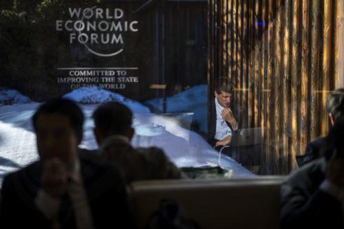 epa12664314 Participants work on their computers during the 56th annual meeting of the World Economic Forum (WEF) in Davos, Switzerland, 20 January 2026. The meeting, held under the theme 'A Spirit of Dialogue,' brings together entrepreneurs, scientists, and corporate and political leaders and runs from 19 to 23 January.  EPA/GIAN EHRENZELLER