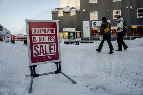 epa12666320 People walk along an icy street in Nuuk, Greenland, 20 January 2026 (issued 21 January 2026).  EPA/MADS CLAUS RASMUSSEN  DENMARK OUT