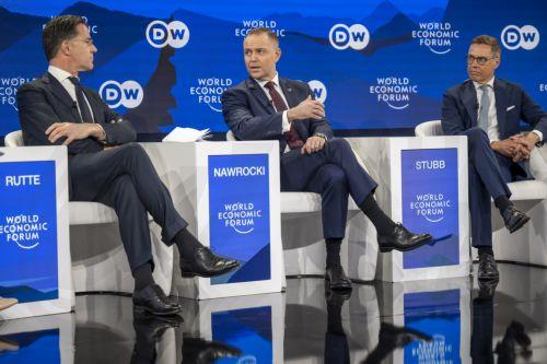 epa12666920 Secretary-General, North Atlantic Treaty Organization (NATO) Mark Rutte (L), President of Poland Karol Nawrocki (C), and President of Finland Alexander Stubb (R) speak during a panel discussion during the 56th annual meeting of the World Economic Forum (WEF) in Davos, Switzerland, 21 January 2026. The meeting under the topic 'A Spirit of...