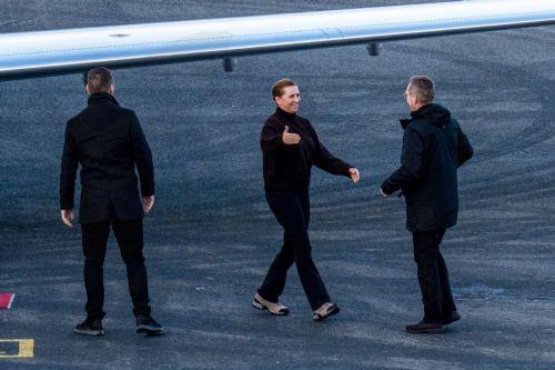 epa12674877 Danish Prime Minister Mette Frederiksen (C) at the airport in Nuuk, Greenland, 23 January 2026. Frederiksen is in Greenland to meet with Greenland's head of government Jens-Frederik Nielsen.  EPA/Rodrigo Freitas NORWAY OUT