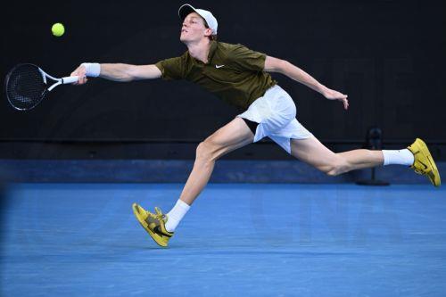 epa12681934 Jannik Sinner of Italy in action during the Men’s 4th round match against compatriot Luciano Darderi on day 9 of the 2026 Australian Open tennis tournament at Melbourne Park in Melbourne, Australia, 26 January 2026.  EPA/JOEL CARRETT AUSTRALIA AND NEW ZEALAND OUT