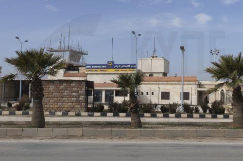 epa12685031 An entrance to Al-Qamishli airbase, northeast Syria, 27 January 2026. According to the Britain-based war monitor Syrian Observatory for Human Rights (SOHR) the Russian forces started to partially transport military and logistical equipment from their positions in Al-Qamishli to the military airbase in Latakia countryside.  EPA/AHMED MARDINLI