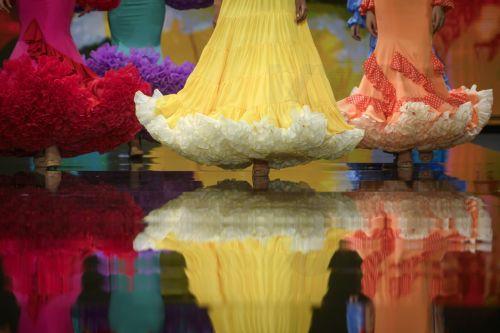 epa12690213 A model takes to the catwalk with some creations by Huelva's region designers under the motto 'Flamenco by Nature' during the International Flamenco Fashion Week held in Seville, Spain, on 29 January 2026.  EPA/Raul Caro
