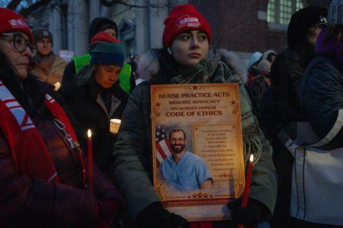 epa12691790 A person holds a sign during a vigil for Veterans Affairs (VA) nurse Alex Pretti outside a VA hospital in New York, New York, USA, 29 January 2026. Nationwide protests continue after federal immigration operations in Minneapolis resulted in the fatal shootings of two US citizens, Renee Nicole Good and Alex Pretti.  EPA/OLGA FEDOROVA