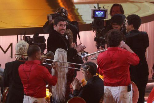 epa12699567 Bad Bunny (C) reacts during the 68th annual Grammy Awards ceremony at Crypto.com Arena in Los Angeles, California, USA, 01 February 2026.  EPA/CHRIS TORRES
