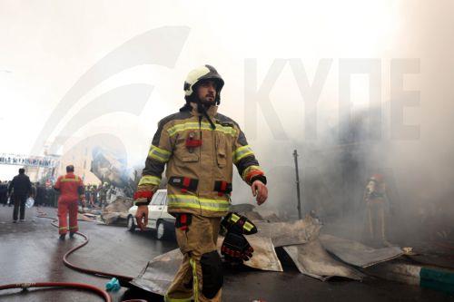 epa12701674 Firefighters try to control the fire at the Jannat shopping market in western Tehran, Iran, 03 February 2026. The cause of the fire is unclear.  EPA/ABEDIN TAHERKENAREH