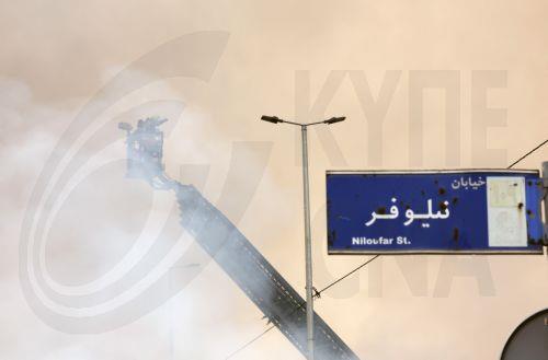 epa12701683 Firefighters try to control the fire at the Jannat shopping market in western Tehran, Iran, 03 February 2026. The cause of the fire is unclear.  EPA/ABEDIN TAHERKENAREH