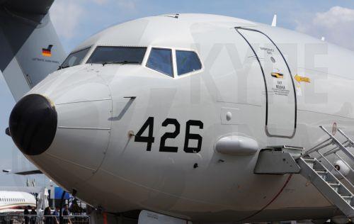 epa12701933 Visitors look at a US Navy Boeing P-8 Poseidon maritime patrol aircraft on static display during the Singapore Airshow at Changi Exhibition Centre, Singapore, 03 February 2026. The Singapore Airshow 2026, one of Asia’s largest aerospace and defense exhibitions, runs from 03 to 08 February.  EPA/HOW HWEE YOUNG