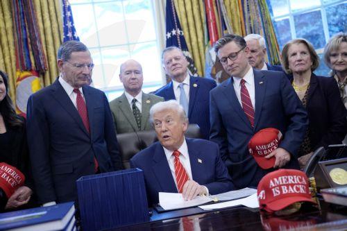 epa12703463 US President Donald Trump (C) participates alongside House Speaker Mike Johnson (C-R) in a bill signing ceremony in the Oval Office of the White House in Washington, DC, USA, 03 February 2026. The bill passed by the House of Representatives restores funding for several major federal departments, ending the partial government shutdown that began...