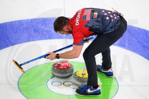 epa12719738 Korey Dropkin of the United States competes in the Mixed Doubles match between USA and Italy of the Curling competition, at the Milano Cortina 2026 Winter Olympic Games in Cortina d'Ampezzo, Italy, 09 February 2026.  EPA/JURE MAKOVEC
