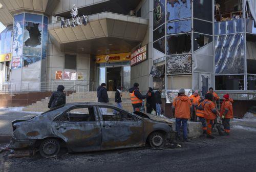 epa12719863 Ukrainian people and communal workers inspect the damage at the site of a Russian strike in Odesa, southwestern Ukraine, 09 February 2026, amid the Russian invasion. At least one person was killed and two others injured after a drone hit a residential area, damaging a high-rise building and a gas pipeline, according to the State Emergency...