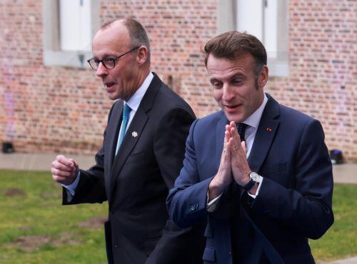 epa12730222 France's president Emmanuel Macron (R) and Germany's Chancellor Friedrich Merz arrive to attend the Informal EU leaders' retreat at Alden Biesen Castle in Bilzen, Belgium, 12 February 2026. The strategic session focuses on deepening the Single Market, boosting investment, and enhancing Europe's competitiveness in a shifting geoeconomic...