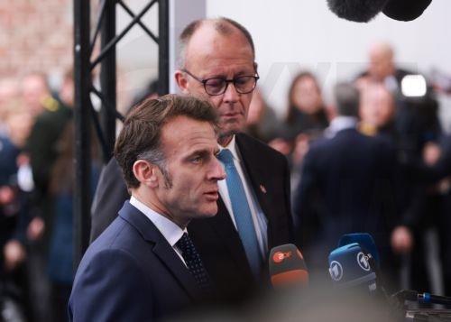 epa12730230 France's president Emmanuel Macron (L) and Germany's Chancellor Friedrich Merz speak to the press upon arrival at the Informal EU leaders' retreat at Alden Biesen Castle in Bilzen, Belgium, 12 February 2026. The strategic session focuses on deepening the Single Market, boosting investment, and enhancing Europe's competitiveness in a shifting...