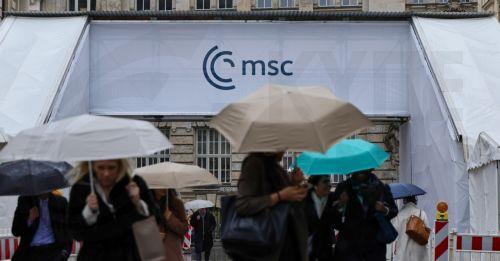 epa12731188 People walk in front of the hotel 'Bayerischer Hof', the venue of the 62nd Munich Security Conference (MSC), in Munich, Germany, 12 February 2026. The 62nd Munich Security Conference, running from 13 to 15 February 2026, is expected to host around 50 world leaders.  EPA/RONALD WITTEK