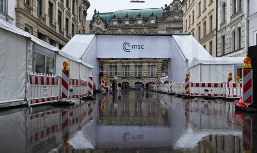 epa12731191 People walk in front of the hotel 'Bayerischer Hof', the venue of the 62nd Munich Security Conference (MSC), in Munich, Germany, 12 February 2026. The 62nd Munich Security Conference, running from 13 to 15 February 2026, is expected to host around 50 world leaders.  EPA/RONALD WITTEK