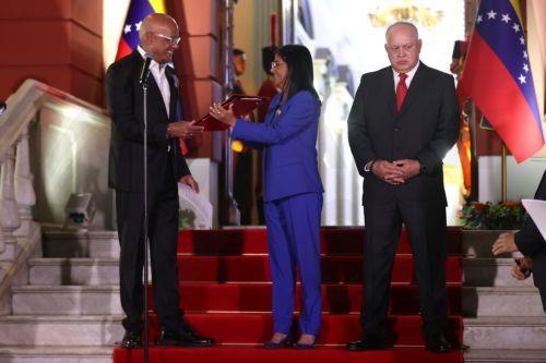 epa12760441 The acting president of Venezuela, Delcy Rodriguez, holds the document of the approved amnesty law alongside the president of the National Assembly, Jorge Rodriguez (L), and the Minister of Interior Relations, Justice, and Peace, Diosdado Cabello, in Caracas, Venezuela, 19 February 2026. Rodriguez asked Parliament, the program that promotes...
