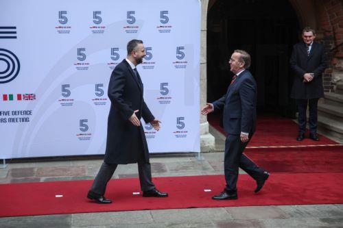 epa12760804 Polish Deputy Prime Minister, Minister of National Defence Wladyslaw Kosiniak-Kamysz (L) welcomes German Defence Minister Boris Pistorius (C) before the meeting within the E5 Group in Krakow, Poland, 20 February 2026. Poland is hosting a meeting of the E5 Group (European Five), an informal high-level defense alliance comprising France, Germany,...