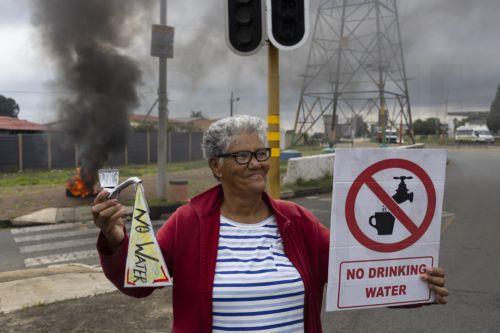 epa12772838 Residents from Coronationville and Westbury take to the streets to protest against the lack of water supply in many parts of Johannesburg, South Africa, 24 February 2026. The city is facing an increasingly dire water situation, with many areas already experiencing 'Zero Day' as their taps run dry. A combination of power supply issues, ailing...
