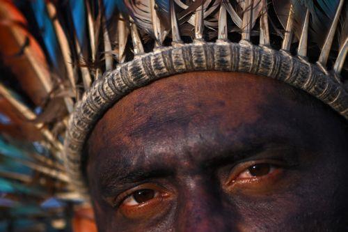 epa12774772 An indigenous person celebrates after the Brazilian government repeals Decree 12600 in front of the Planalto Palace in Brasilia, Brazil, 24 February 2026. The decree had authorized concessions for the construction of three waterways in the Amazon and sparked protests from indigenous groups concerned about the effects of river dredging on their...