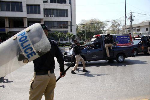 epa12786657 Protestors clash with security forces in Karachi, Pakistan, on 01 March 2026, near the US consulate after Iranian Supreme Leader Ayatollah Ali Khamenei was killed in an Israeli airstrike in Iran. At least 9 protestors were killed in the clashes, according to reports. According to a statement from Iranian state media issued on 01 March 2026,...