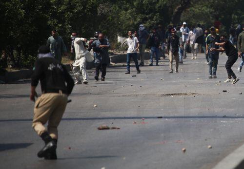 epa12786660 Protestors clash with security forces in Karachi, Pakistan, on 01 March 2026, near the US consulate after Iranian Supreme Leader Ayatollah Ali Khamenei was killed in an Israeli airstrike in Iran. At least 9 protestors were killed in the clashes, according to reports. According to a statement from Iranian state media issued on 01 March 2026,...