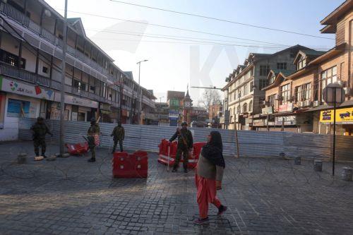 epa12788724 Indian paramilitary personnel patrol behind barbed wire and barricades near the sealed city centre at Lal Chowk during restrictions in Srinagar, Kashmir, India, 02 March 2026. The authorities imposed severe restrictions a day after Shia Muslim demonstrators staged massive protests and assembled in the city centre near the iconic clock tower in...