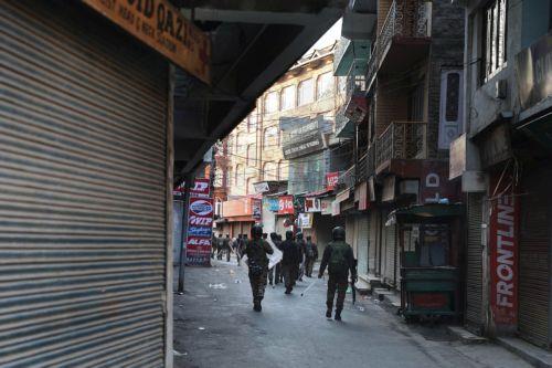 epa12788726 Indian paramilitary personnel patrol near the sealed city centre at Lal Chowk during restrictions in Srinagar, Kashmir, India, 02 March 2026. The authorities imposed severe restrictions a day after Shia Muslim demonstrators staged massive protests and assembled in the city centre near the iconic clock tower in Srinagar, holding posters of...