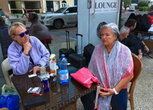 epa12789640 Passengers stranded by suspended air traffic from Austria and Serbia wait in front of a hotel in Doha, Qatar, 02 March 2026. Following a joint Israel-US military operation targeting multiple locations across Iran in the early hours of 28 February 2026 and Iran's retaliatory attacks across the region, several countries closed their airspace and...