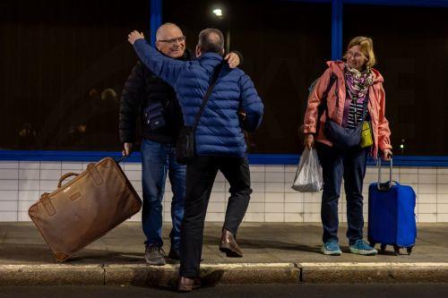 epa12792884 People hug as they leave the terminal after they arrived on a Czech repatriation flight from Amman, Jordan, at the Vaclav Havel airport in Prague, Czech Republic, 03 March 2026. The first evacuation flight carried Czech citizens who were stranded in the Middle East. The Czech Republic and other countries are evacuating their citizens from the...