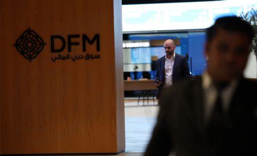 epa12793740 Traders work at the Dubai Financial Market (DFM) in the Gulf emirate of Dubai, United Arab Emirates, 04 March 2026. The Dubai Financial Market has reopened with other Emirates markets resuming trading across the UAE after two days of closure amid heightened military tensions following joint US-Israeli strikes on Iran and Iran's retaliatory...