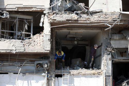 epa12793860 People work at a damaged building in central Tehran, Iran, 04  March 2026. A joint Israeli and US military operation continues to target multiple locations across Iran since the early hours of 28 February 2026.  EPA/ABEDIN TAHERKENAREH