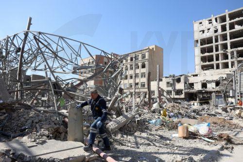 epa12793861 An Iranian worker cleans damage to a building in central Tehran, Iran, 04 March 2026. A joint Israeli and US military operation continues to target multiple locations across Iran since the early hours of 28 February 2026.  EPA/ABEDIN TAHERKENAREH