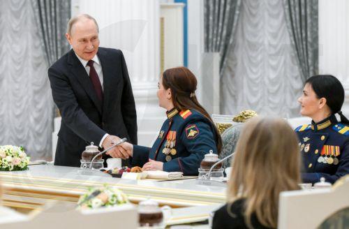 epa12797418 Russian President Vladimir Putin (L) meets with women representing various professional fields to congratulate them with the upcoming International Women's Day at the Kremlin, in Moscow, Russia, 05 March 2026.  EPA/PELAGIYA TIKHONOVA / SPUTNIK / KREMLIN POOL MANDATORY CREDIT