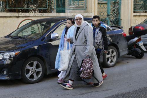 epa12805923 People carry their belongings after fleeing their homes following Israeli airstrikes in Beirut, Lebanon, 09 March 2026. The Israeli military stated it is conducting strikes across the country targeting Hezbollah infrastructure and personnel. According to the Disaster Management Unit of the Lebanese government, as of 08 March 2026, more than...