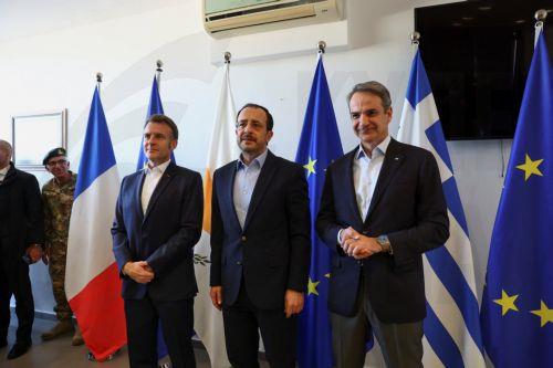 epa12806275 French President Emmanuel Macron (C) meets Cypriot President Nikos Christodoulides (R) and Greek Prime Minister Kyriakos Mitsotakis (L) as part of a visit focused on supporting Cyprus after recent drone attacks amid the U.S.-Israeli conflict with Iran, and strengthening European coordination in the region, in Paphos, Cyprus, 09 March 2026. ...